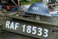 Vintage RAF helmet on vehicle bonnet.