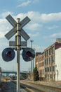 Vintage railroad crossing signal behind old warehouses in urban Atlanta Georgia