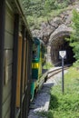 Vintage Railroad Train Enters a Dark Tunnel Royalty Free Stock Photo