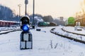 Vintage railway traffic light on an old snow covered railway station. Trains, rails, travel, abandoned