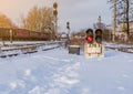 Vintage railway traffic light on an old snow covered railway station. Trains, rails, travel, abandoned