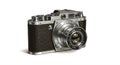 Vintage rangefinder camera featuring a textured black leather body and silver Royalty Free Stock Photo