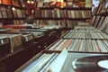 Vintage record store with rows of vinyl records and cassette tapes Royalty Free Stock Photo