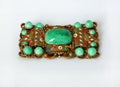 Vintage rectangular brooch with green stones