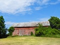 Vintage NYS FingerLakes red barn under blue sky Royalty Free Stock Photo