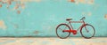 Vintage Red Bicycle Against Teal Wall Royalty Free Stock Photo