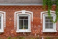 Vintage red brick building with hanging plant Royalty Free Stock Photo