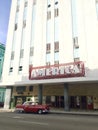 Vintage red car at America theatre in habana cuba