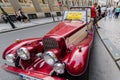 Vintage red car in front of Prague castle