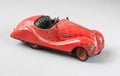 Car toy vintage red on a gray background insulated