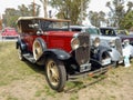 Old 1931 Chevrolet Chevy Phaeton convertible by GM in park. Nature, trees. AAA 2022 classic car show