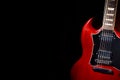 Vintage red electric guitar on moody dark background Royalty Free Stock Photo