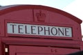 Vintage red English telephone booth with crown