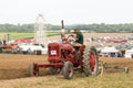 Vintage red farmall Tractor ploughing