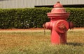 Vintage Red Fire Hydrant in Front of Building Royalty Free Stock Photo
