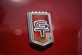 Vintage Red Ford Mustang GT Badge from a classic car, automobile retro design Royalty Free Stock Photo