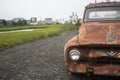 Ford v8 Vintage red pickup truck on a suburban driveway in summer Royalty Free Stock Photo