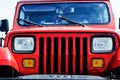 Vintage red Jeep car front side