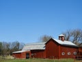 Vintage red joined livestock barns with cupola Royalty Free Stock Photo