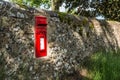 Vintage Red Letter box in a fence Royalty Free Stock Photo