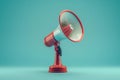 Vintage red megaphone standing on blue background Royalty Free Stock Photo