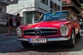 Vintage red Mercedes-Benz 230 SL oldsmobile veteran car standing on street Royalty Free Stock Photo