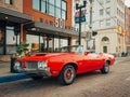 A vintage red Oldsmobile 442, in downtown Flint, Michigan