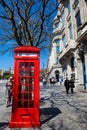 Vintage red phone booth ad the beautiful antique buildings around the Liberdade Square at Porto city Royalty Free Stock Photo