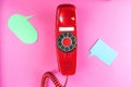 Vintage red phone and speech ballons Royalty Free Stock Photo