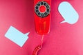 Vintage red phone and speech ballons Royalty Free Stock Photo