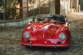 vintage red Porsche in town