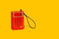 A vintage red portable radio on a yellow background Royalty Free Stock Photo
