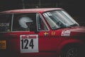 Vintage red racing car with a driver wearing a helmet at the Zabra Rally in Sweden Royalty Free Stock Photo