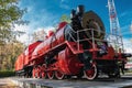 Vintage red steam locomotive for rail cars Royalty Free Stock Photo