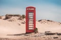 A vintage red telephone box in the sand dunes of a deserted beach at Studland, near Sandbanks, Dorset, England, UK Royalty Free Stock Photo