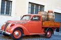 Vintage red van with old wooden barrels of wine Royalty Free Stock Photo