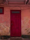 Vintage red wooden door. Antique building exterior detail. Street photo. Retro wood boards.Empty abstract grunge texture Royalty Free Stock Photo