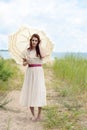 Vintage redhead woman on beach trail Royalty Free Stock Photo