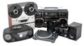 Vintage reel-to-reel tape recorder, boombox, phonograph turntable, and modern stereo system. Evolution of music appliance, concept Royalty Free Stock Photo