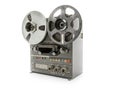 Vintage reel-to-reel tape recorder on white