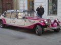 Vintage rental car parked on a street in Prague