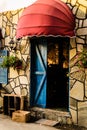 Vintage Restaurant Window With Colorful Shutters And Umbrella