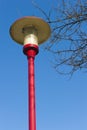 Ancient lamppost at parking of gasstation on highw