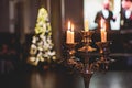 Vintage retro brass candlesticks with candles burning, luxury event banquet table setting decoration in a restaurant hall, Royalty Free Stock Photo