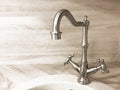 Vintage retro brass water tap faucet closeup on light background