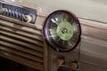 Vintage retro car dashboard with analog clock and audio radio system with buttons, handmade with wood and chrome for Royalty Free Stock Photo
