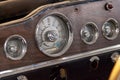 Vintage retro car dashboard with analog speedometer, tachometer and odometer, handmade with wood and chrome