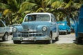 vintage, retro classic cars parked near the ocean