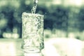 Vintage and retro color tone of the glass of cool water with som Royalty Free Stock Photo