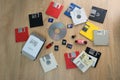 Vintage retro electronic data storage devices from the 80s, 90s, cd disk, flash drives scattered on table. Stack of floppy disks,